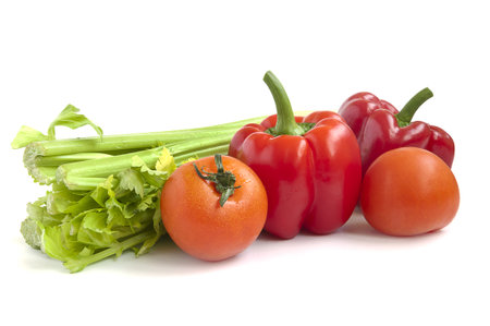 tomatoes  pepper and celery on a white backgroundの写真素材