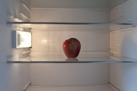 apple on a shelf in the refrigeratorの写真素材