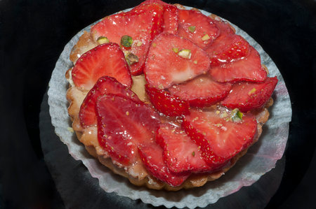 cake with strawberries on a black backgroundの写真素材