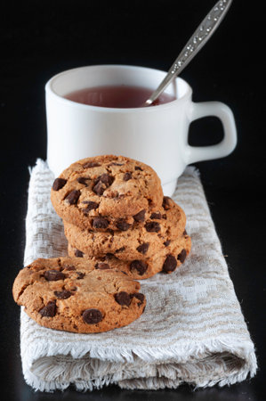 Cookies with Chocolate and ... on a Black Backgroundの写真素材