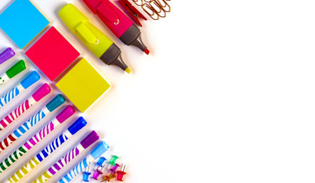 school office supplies on a white background. felt-tip pens markers paper clips top view.の写真素材