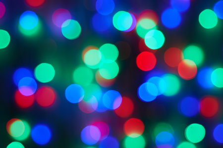 abstract colorful bokeh background, defocused christmas lightsの写真素材