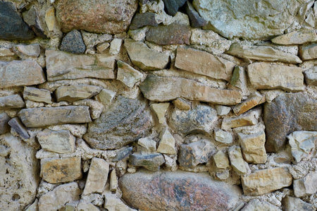 Background of stone wall texture. Closeup of stone wall texture.の写真素材