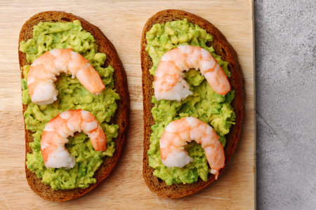 sandwich with shrimp and avocado on light backgroundの写真素材