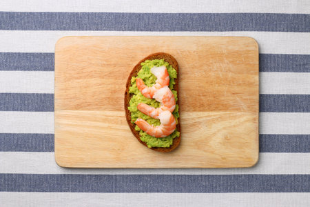 sandwich with shrimp and avocado on wood. breakfast conceptの写真素材