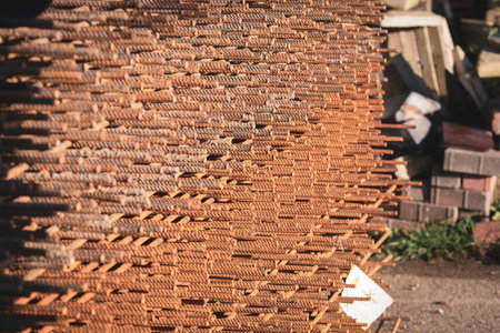 Iron rods stacked up at a construction site.