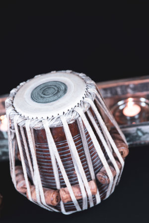 Tabla - Indian classical drums - Diwali tea light in the background.の写真素材