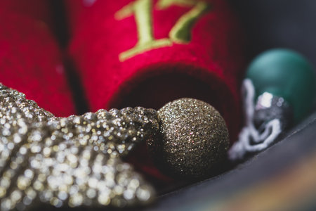 Advent calendar with dates - small red tubs - next to a miniature Christmas tree.rの写真素材