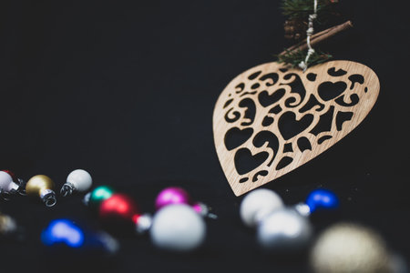 Christmas tree baubles and rustic heart, with copy space.の写真素材