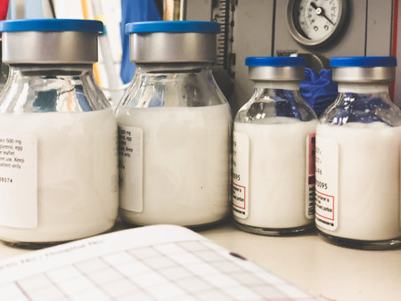 Bottles of the anaesthetic drug Propofol on an anaesthetic machine with the suction dial visible in...