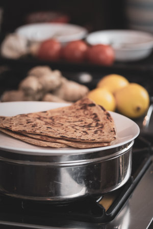 Roti or flat bread - being made fresh in a shallow pan.の写真素材