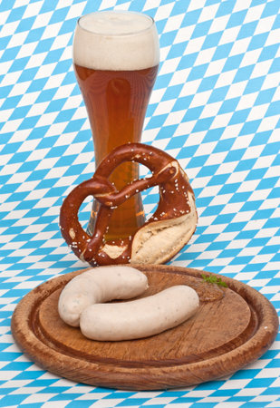 Weisswurst is a traditional Bavarian dish  It is usually served with Pretzel, sweet mustard and Weissbier の写真素材