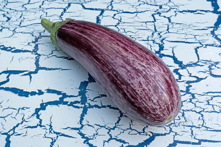 Graffiti eggplant on cracky surfaceの写真素材