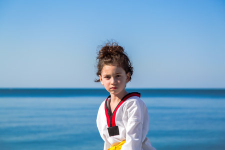 The girl training on the beach: Taekwondo, sportsの写真素材
