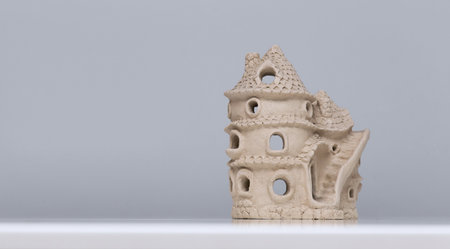 Doll house made of clay. Ceramic fairy tale toy.の写真素材