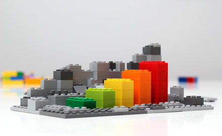 Progress chart made of bricks. Isometric composition of colorful toys on white table.の写真素材