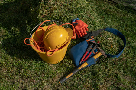work on construction sites, individual protection of helmet, hammer and gloves symbol of work, carpenters and construction sites workers.の写真素材