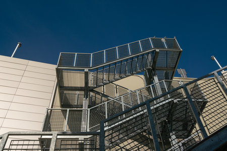 fire escape staircase, pedestrian passage for emergency exit. particular structure in galvanized stainless steel, with detail of the steel beams and their bolting.の写真素材