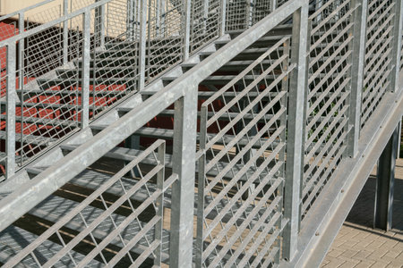 fire escape staircase, pedestrian passage for emergency exit. particular structure in galvanized stainless steel, with detail of the steel beams and their bolting.の写真素材