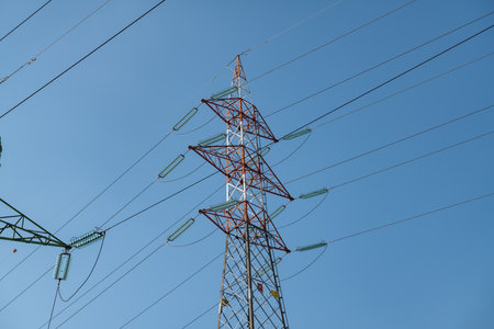 high voltage electricity pylon, a symbol of energy and infrastructure. the iconic and functional metal structure, a symbol of technological progress, supplies the life-giving current to cities. newsの写真素材