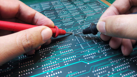 Engineer checking electronic boardの素材