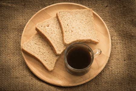 Coffee and bread for breakfast.の写真素材