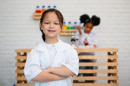 Child in classroom at school, Kid dressed Science lab coat. Science conceptの写真素材