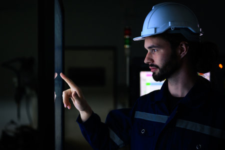 Engineer technician using remote controller controlling machineryの写真素材