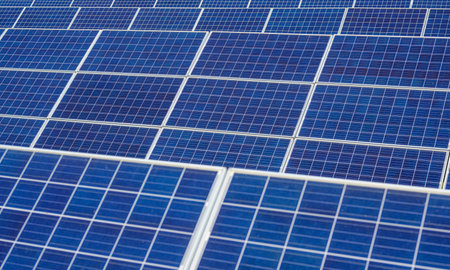 Solar panel station, Engineer installing solar panel at solar energy farm fieldの写真素材