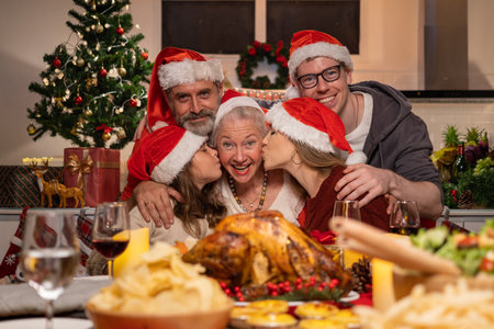 Happy family enjoying with diner party in the dining room celebratingの写真素材