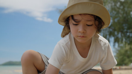 Happy Asian family with barbecue party at camping beach togetherの写真素材