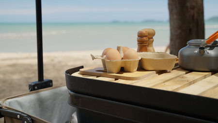 Happy Asian family with barbecue party at camping beach togetherの写真素材