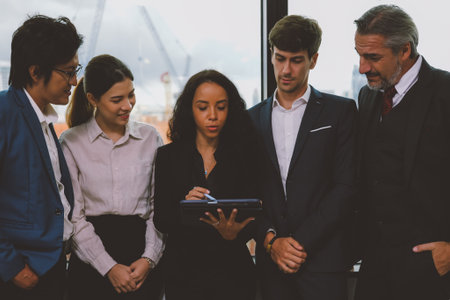 Employee talking and meeting with co-worker team to plan business projectの写真素材