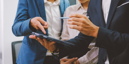 Close up of business officer teamwork brainstorming and talkingの写真素材