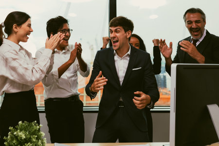 Happy business employees team celebrating success with praise in meeting roomの写真素材