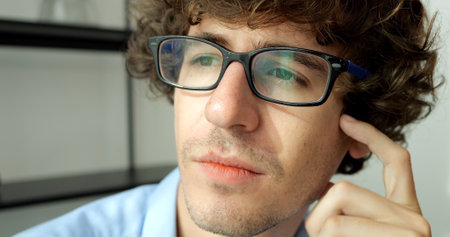 Young man freelance with eyeglasses working at home