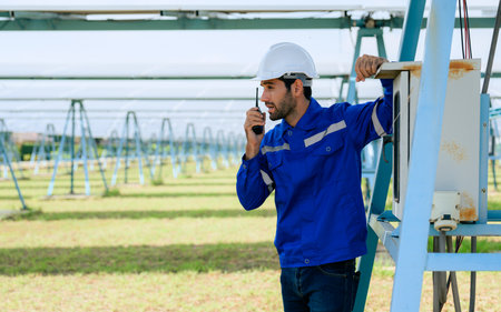 Workers installing solar panels, Engineer team at solar panel farmの写真素材
