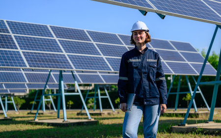 Engineer worker portrait with solar panel at solar farmの写真素材