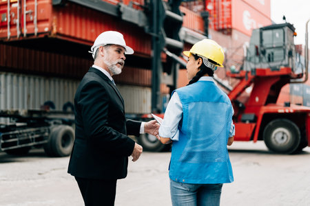 Warehouse engineer worker working at industrial container yardの写真素材