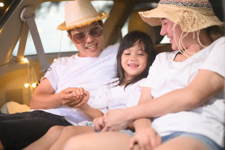 Happy Asian family travel on beach on holidayの写真素材