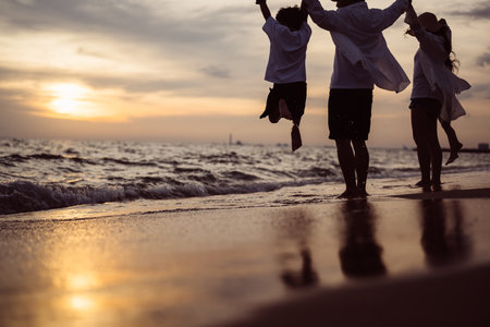 Happy family spending good time together on beach, Family with beach travelの写真素材