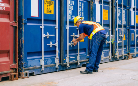 Warehouse engineer worker working at industrial container yardの写真素材