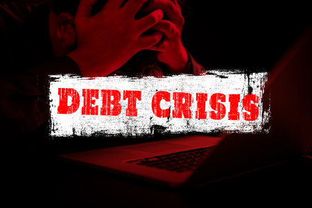 Debt crisis, Stressed businessman with debt and financial failureの写真素材