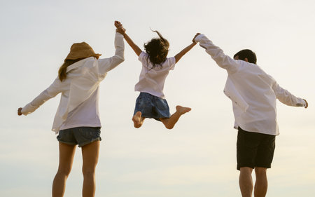 Happy family spending vacation time together on beach, Family with beach travelの写真素材