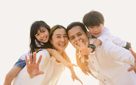 Happy family spending vacation time together on beach, Family with beach travelの写真素材