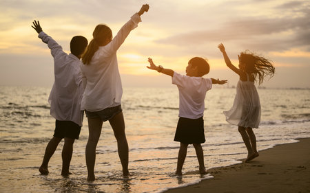 Happy family spending vacation time together on beach, Family with beach travelの写真素材