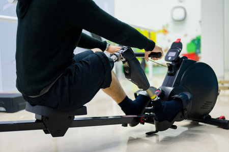 Male patient with physical disability doing exercise routine indoor