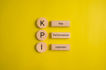Key performance indicator, Businessman holding wooden cube with KPIの写真素材