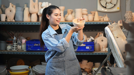 Professional craftsman potter making jug on potter wheel circleの写真素材