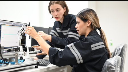 Industrial technicians working with machine maintenanceの写真素材